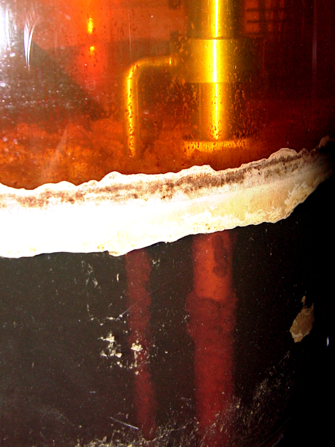 Separating layer organic/aqueous with mulch layer in glass decanter with rod probe for continuous phase separation